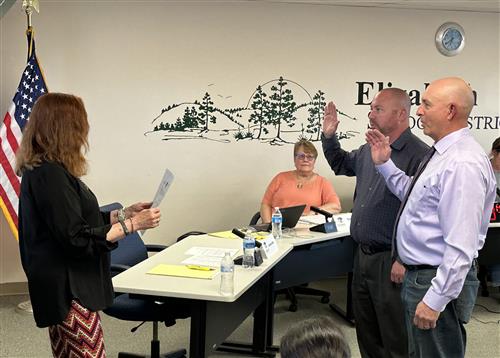 Shellie Scobee, left, swears in new board members Mike Calahan and Jon Waller